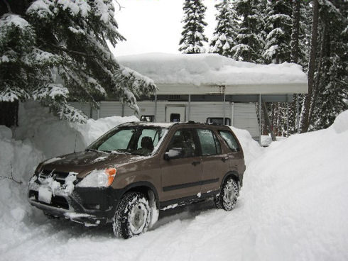 Car and trailer in the big snow